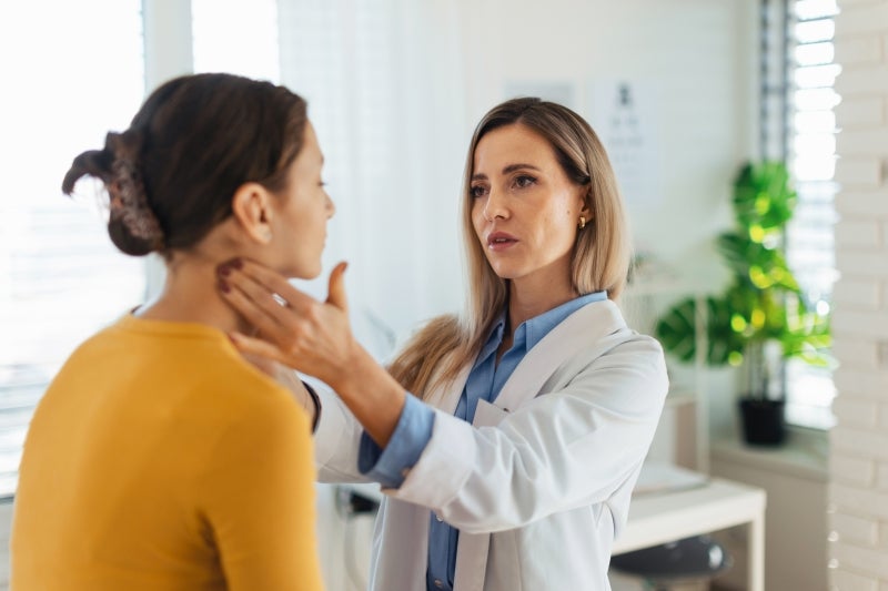 Woman being inspected by a doctor