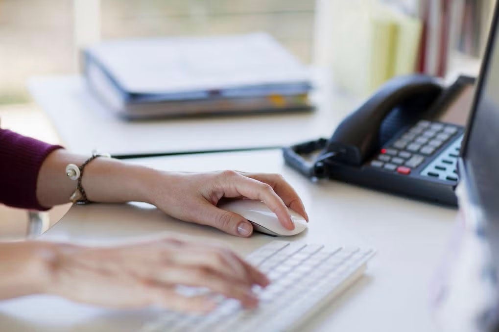 Woman completing onboarding paperwork