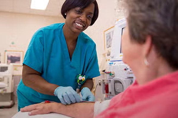 Physician tending to patient
