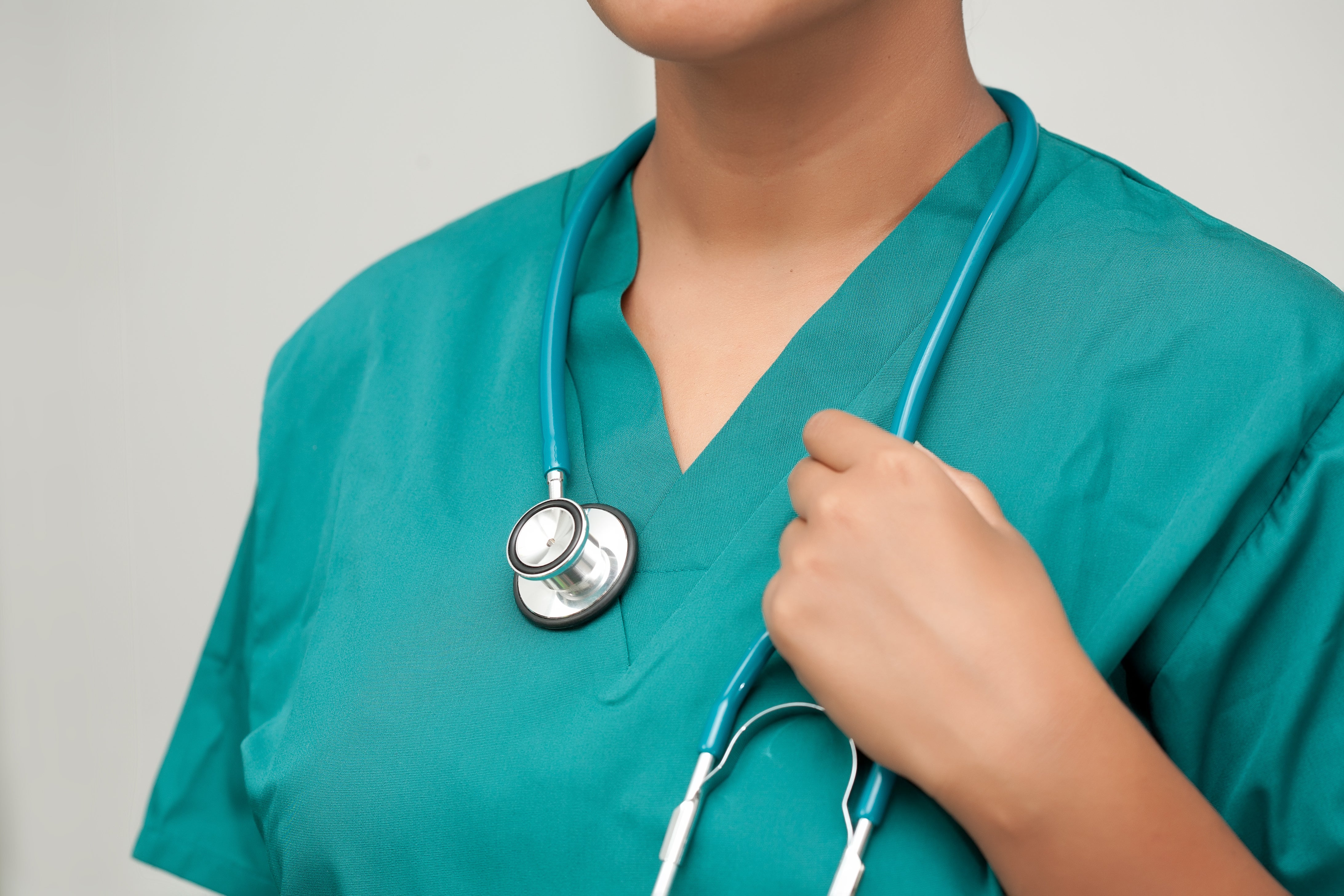Close-up photo of female medical professional wearing a stethoscope