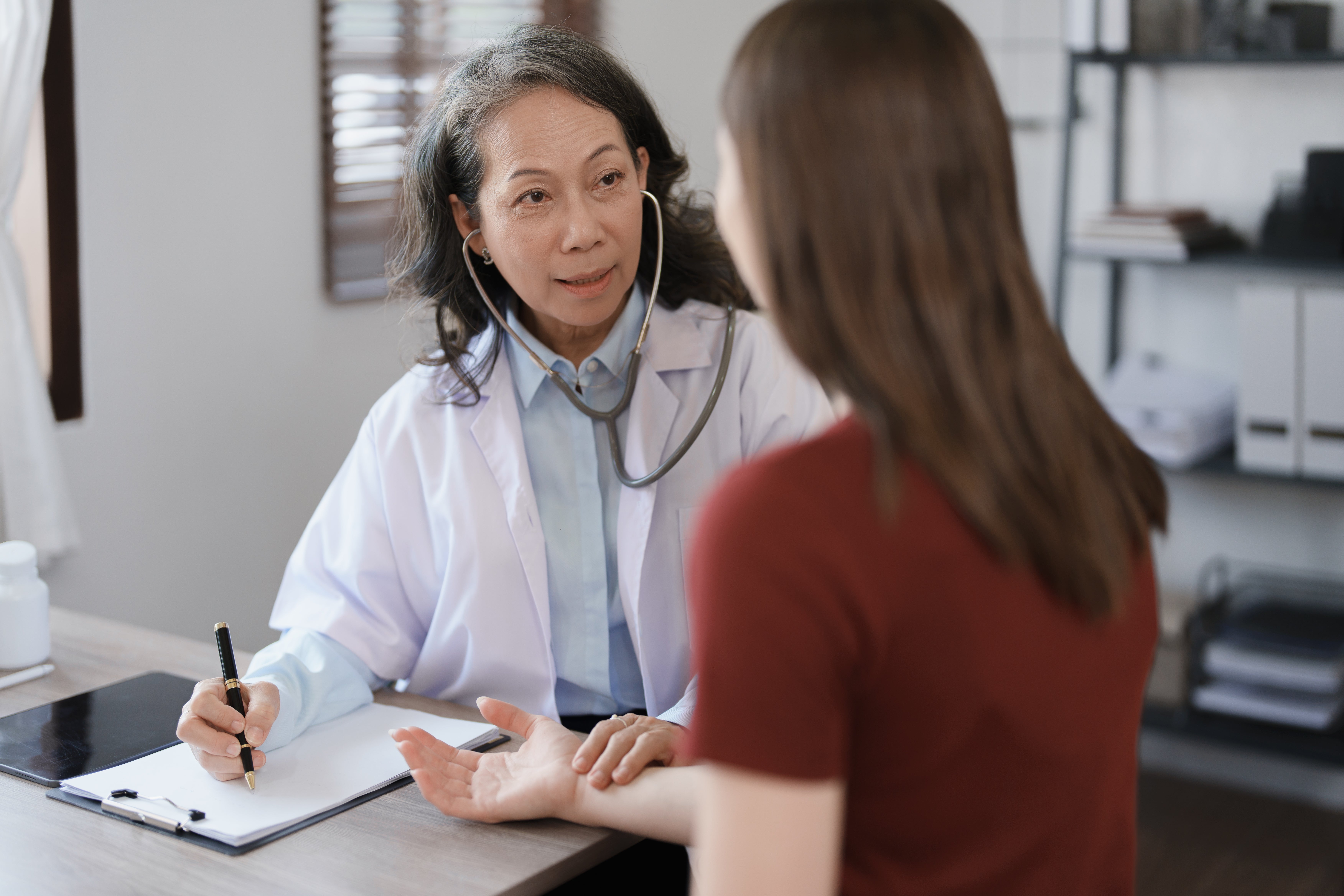 Physician speaking with patient about their medical options