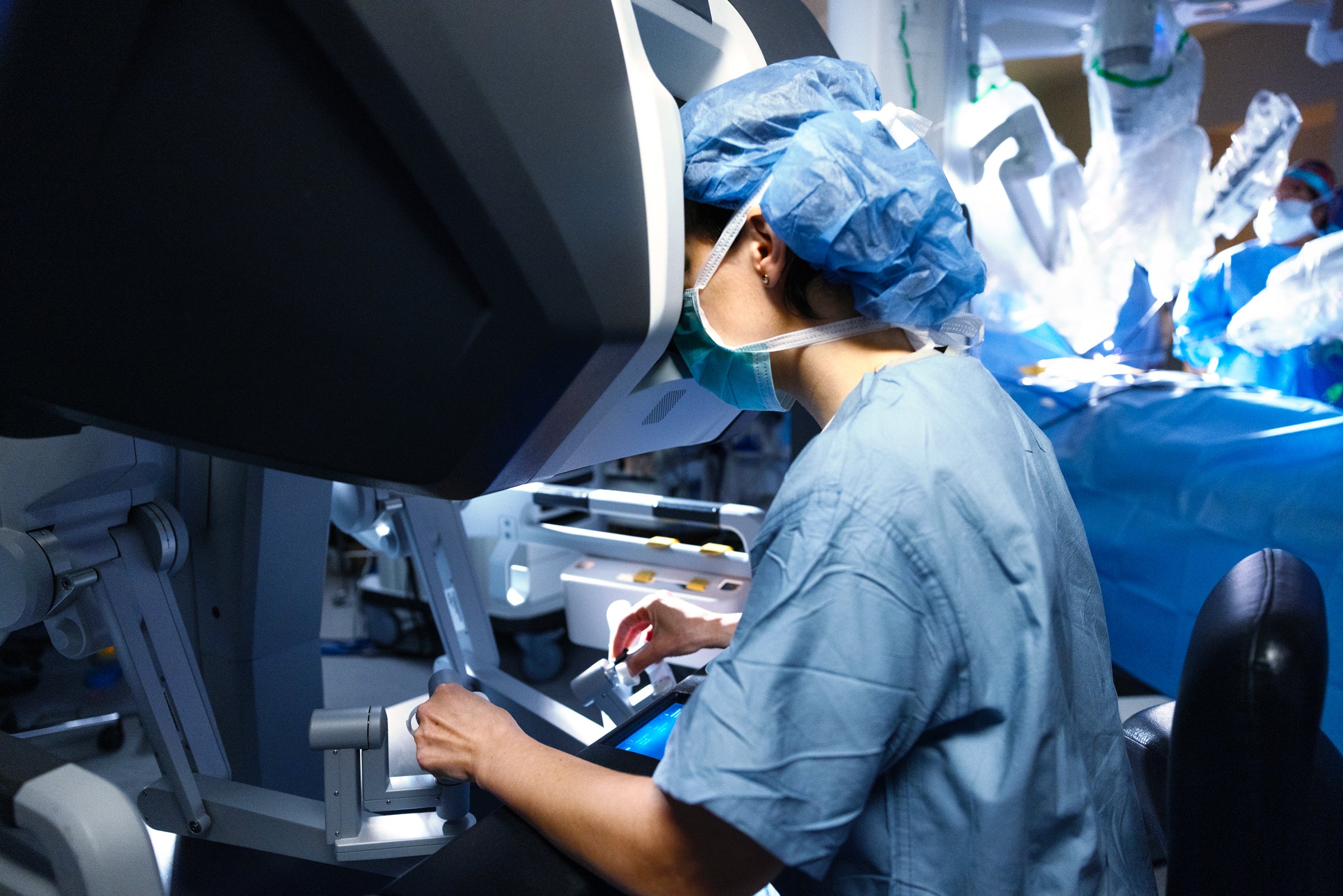 Doctor manipulating robotic surgical technology