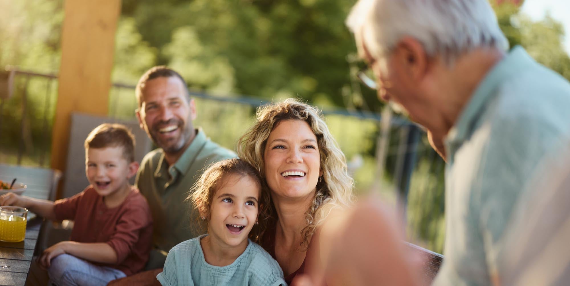 Grandfather talking to his family