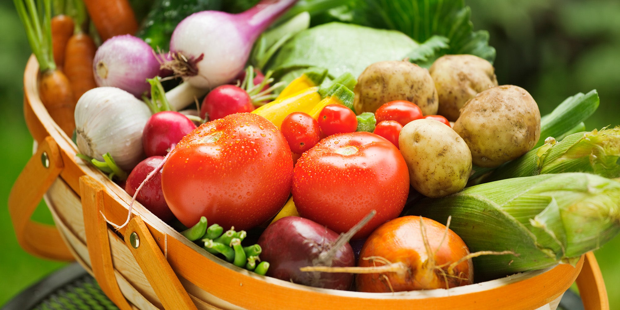 Basket of healthy fruits, vegetables and other foods.