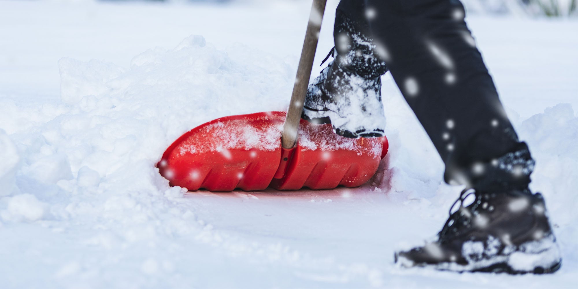 A person shoveling snow outside