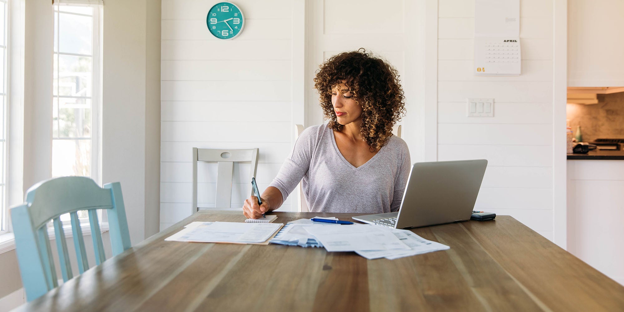 Woman working at home on desk