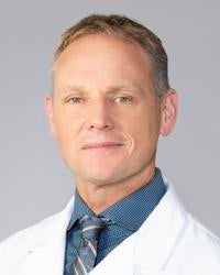 Gregory J Ozark