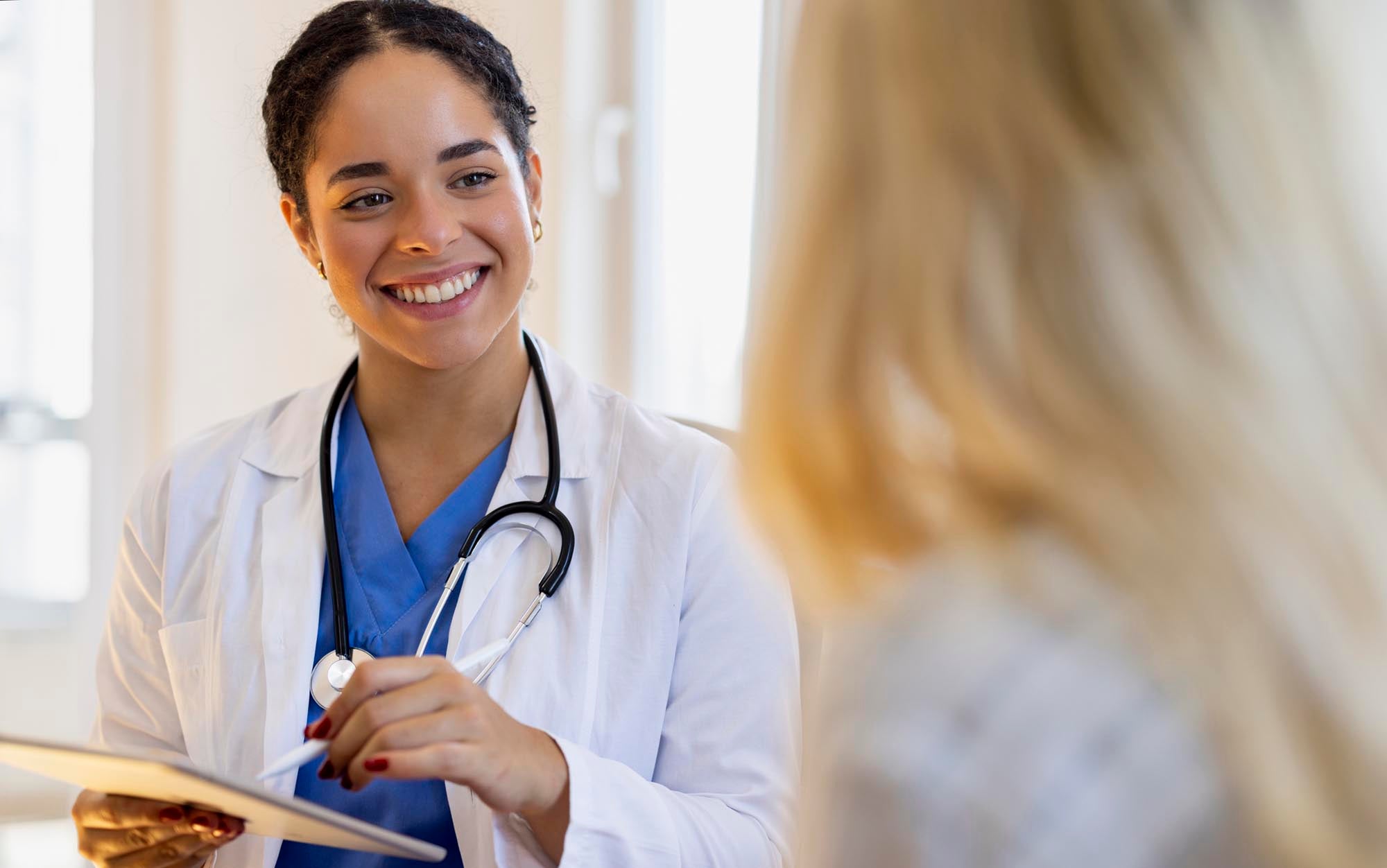 Primary care provider and patient talking