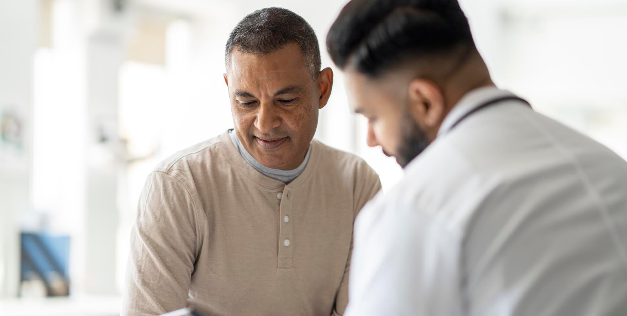 Man talking to physician