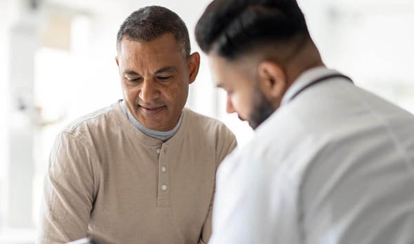 Provider talking to male patient 