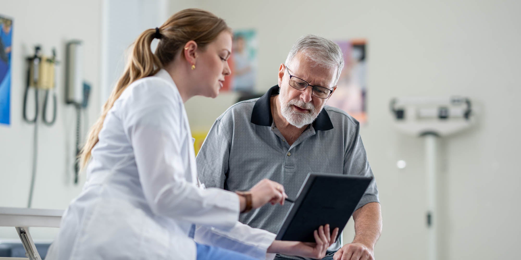 Doctor and patient looking at a tablet