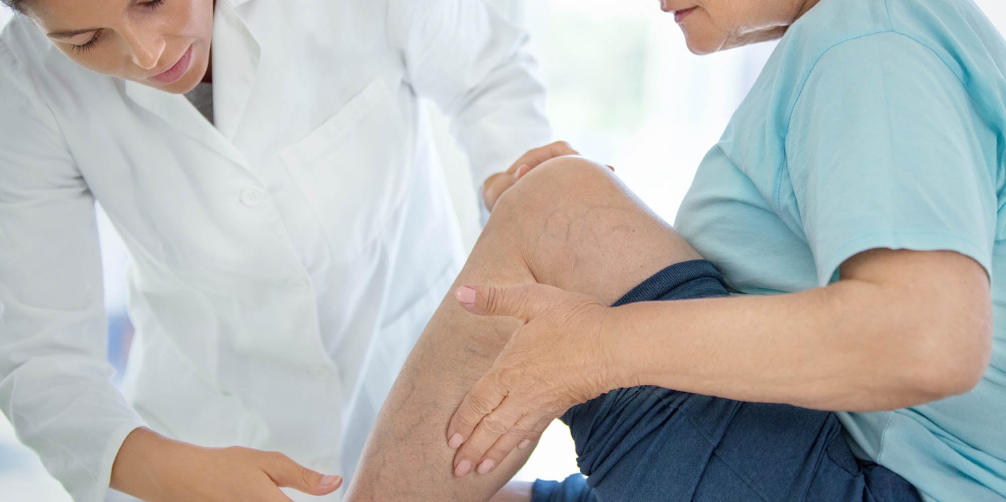 Doctor examining a patient's leg